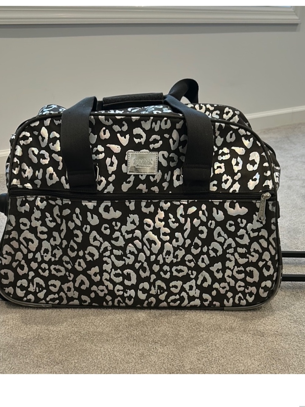 Pink Victoria’s Secret carryon